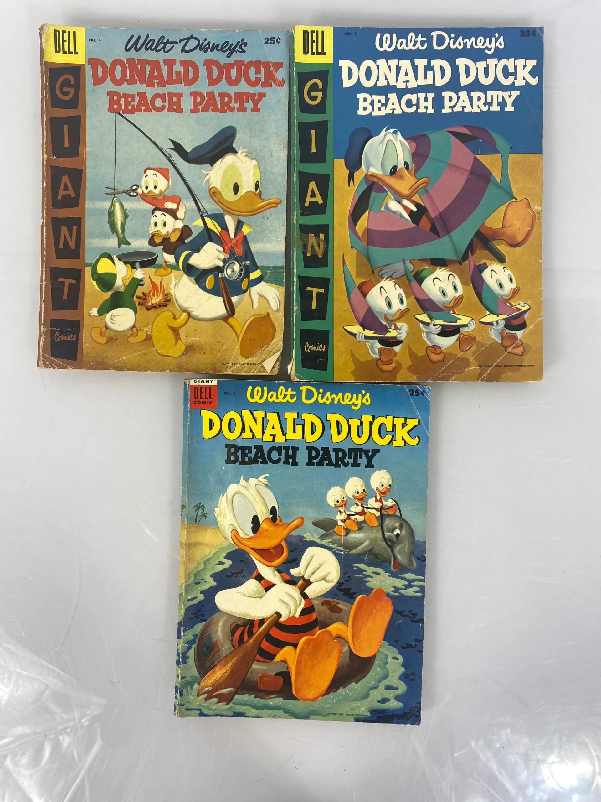 donald-duck-beach-party-lot-of-3-disney-giant-size-dell-comics-1954-1957.webp Donald Duck Beach Party Lot of 3 Disney Giant Size Dell Comics 1954-1957